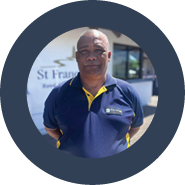A man wearing a blue shirt and yellow stripes stands in front of a building. AI generated content