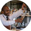 A man in a white shirt is pouring a drink from a bottle into a glass. AI generated content