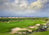 A lush green golf course with sand traps and a large sand bunker. AI generated content